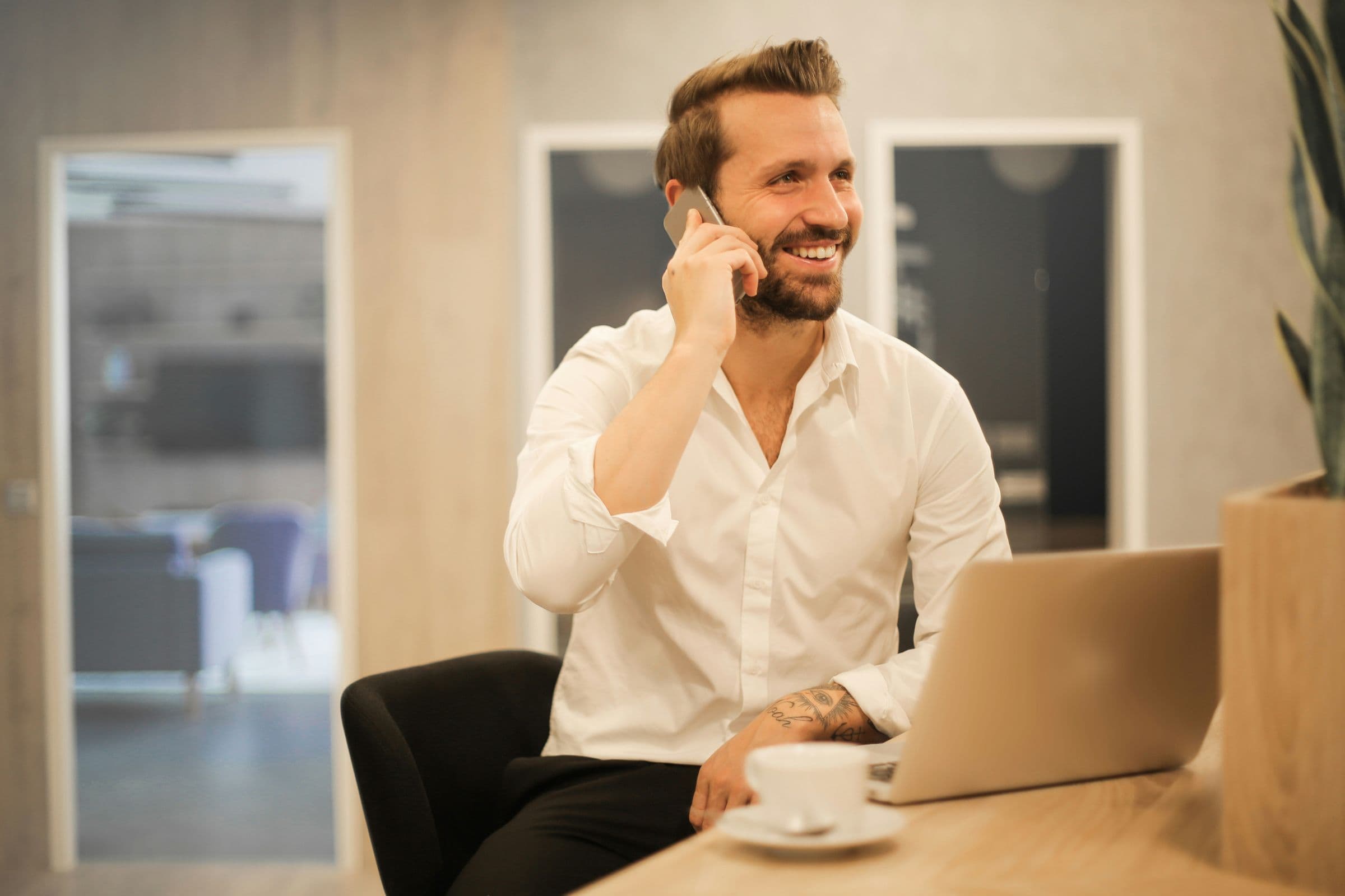 Business owner on a call at his desk